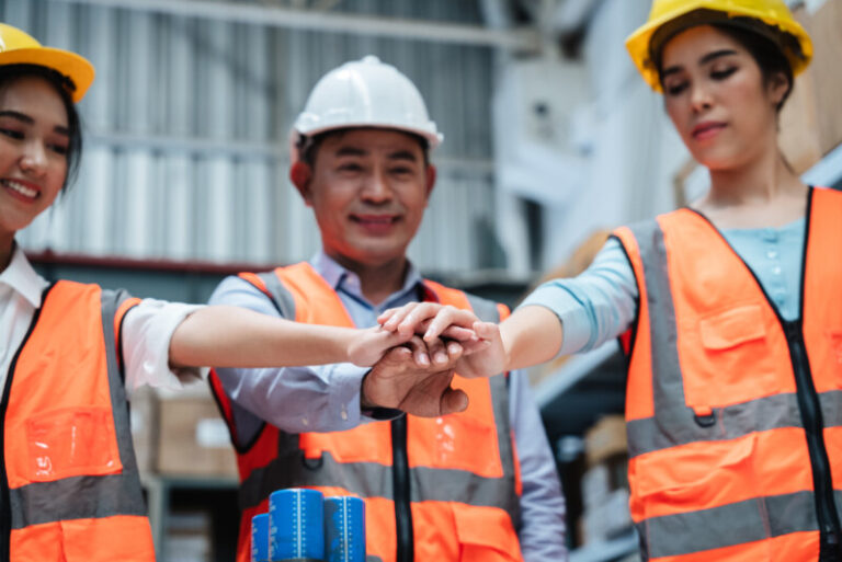 group warehouse workers raise their hands to celeb 2025 03 14 01 00 43 utc